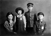Tezuka Osamu with his mother and younger sister and brother